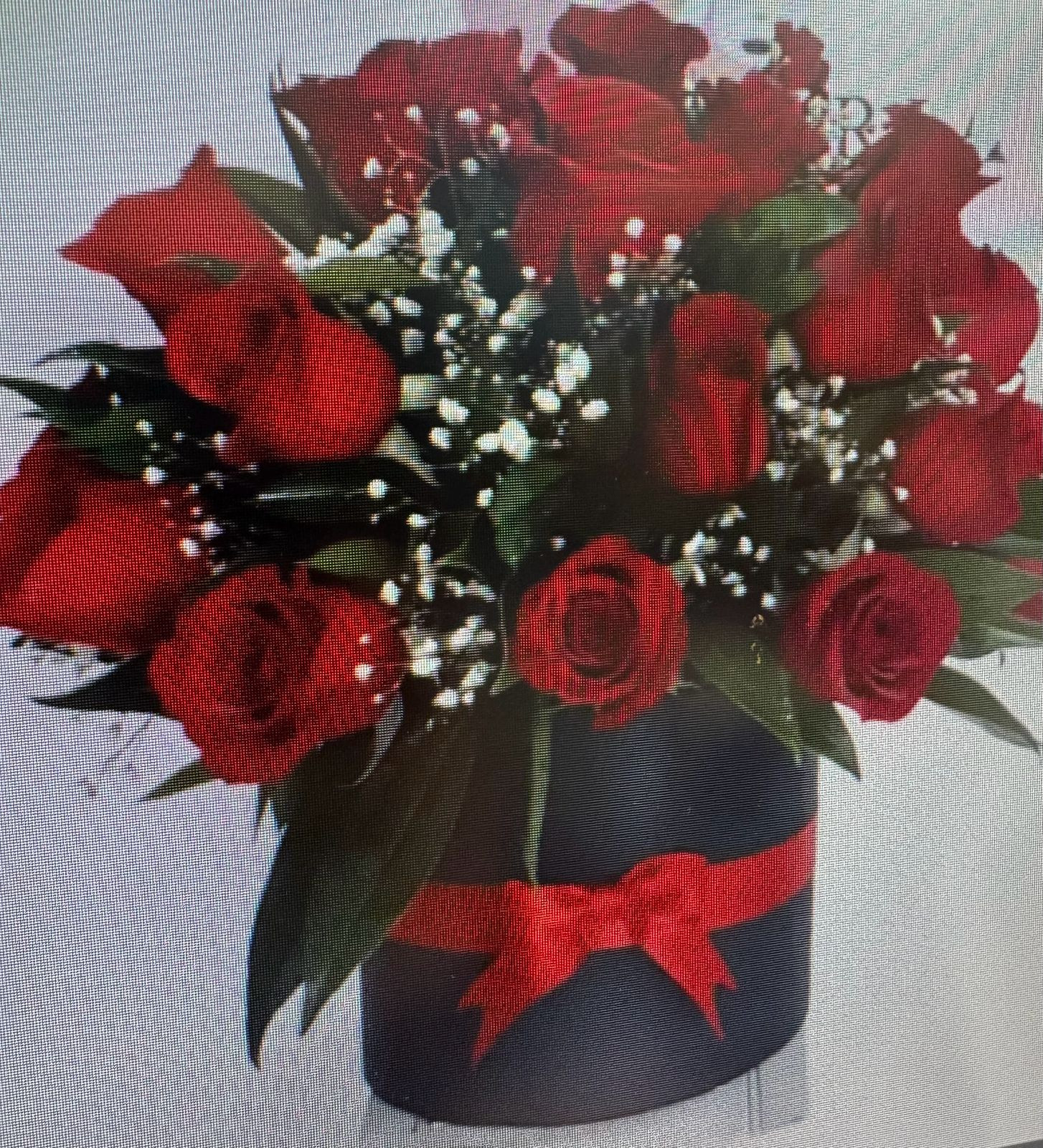 Caja redonda con 25 rosas rojas